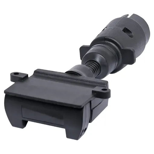 7 pin round to 7 pin flat trailer adapter.  Allows you to connect a trailer with a 7 pin flat connector to a vehicle with large round 7 pin connector.