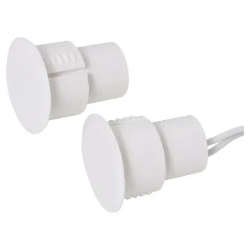 A concealed magnetic reed switch designed for use with metal door frames.